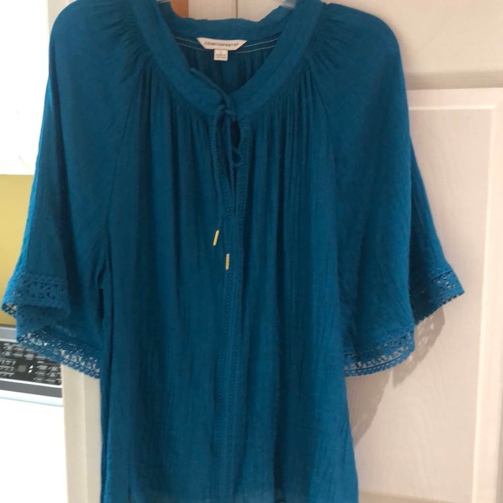 Counterparts size L pullover blouse with tie neckline.